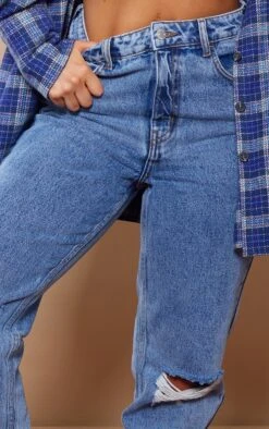 PRETTYLITTLETHING Mid Blue Wash Knee Rip Mom Jeans 10 PRETTYLITTLETHING Mid Blue Wash Knee Rip Mom Jeans -Modern Wear Boutique 22ab364b0b327cd483b5b63b6edaca6b54292e4a cmy6463 4