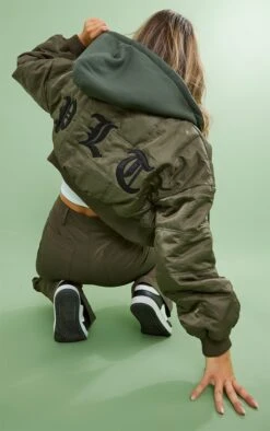 PRETTYLITTLETHING Khaki Slogan Back Jersey Hooded Bomber Jacket