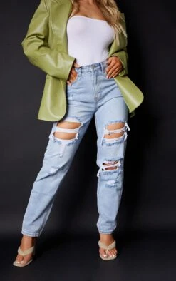 PRETTYLITTLETHING Light Wash Ripped Mom Jeans 9 PRETTYLITTLETHING Light Wash Ripped Mom Jeans -Modern Wear Boutique 34965b6b54d3f6f9663d944bb8048e9115821435 cmc4007 2