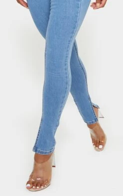 Light Blue Wash Side Split Hem Skinny Jeans -Modern Wear Boutique 40e097977e7692682610848f7f7faf1356a34d66 CMK8883 4