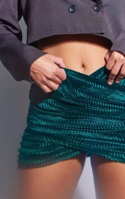 Emerald Green Textured Velvet Wrap Mini Skirt 10 Emerald Green Textured Velvet Wrap Mini Skirt -Modern Wear Boutique 49a5a55420185c6f794a5982846620c0007b0dca cnb4114 5