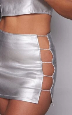 Silver Diamante Cut Out Detail Metallic Coated Denim Mini Skirt -Modern Wear Boutique 5862b29d1f25a1cc361c9382d30537089c6fbf8a cnb1723 5