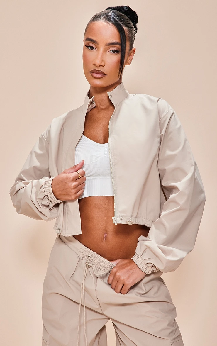 Stone Parachute Zip Up Toggle Hem Cropped Lightweight Jacket 1 Stone Parachute Zip Up Toggle Hem Cropped Lightweight Jacket