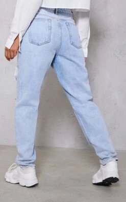 PRETTYLITTLETHING Light Blue Wash Ripped Mom Jeans 9 PRETTYLITTLETHING Light Blue Wash Ripped Mom Jeans -Modern Wear Boutique 8f0e481ef43357e9d2f64411a040365ed576ddf1 cmy6460 3