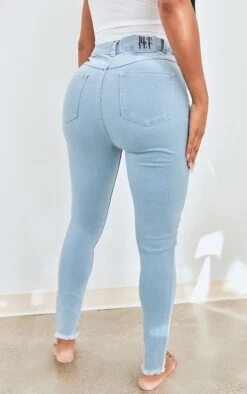 PRETTYLITTLETHING Shape Light Blue Wash High Waist Fray Hem Skinny Jeans -Modern Wear Boutique b1e88d9b111cdbc60dbccbae79b18eb83e5215c0 cmu4725 3