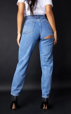 PRETTYLITTLETHING Mid Blue Bum Rip Mom Jeans -Modern Wear Boutique f9a671c2a761e51c3b1f357225431bf5efbb5cf5 cmc4023 3